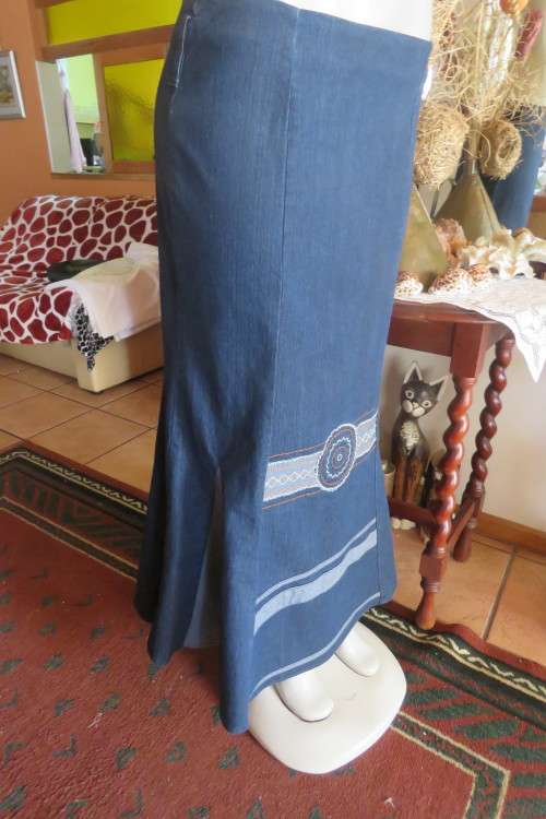 Top of the line ankle length trumpet style cotton stretch denim skirt in size 36/12.