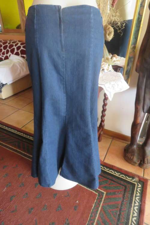 Top of the line ankle length trumpet style cotton stretch denim skirt in size 36/12.