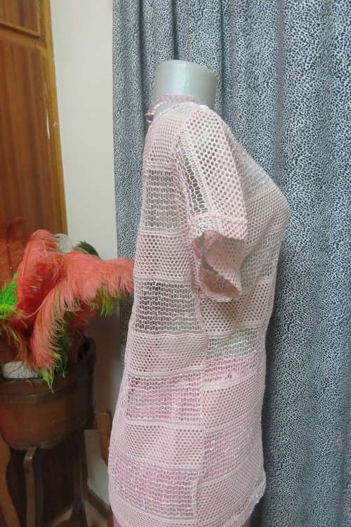 Cute dusty pink mesh type short sleeve top with horizontal lines. Round neckline. Size 36/12.