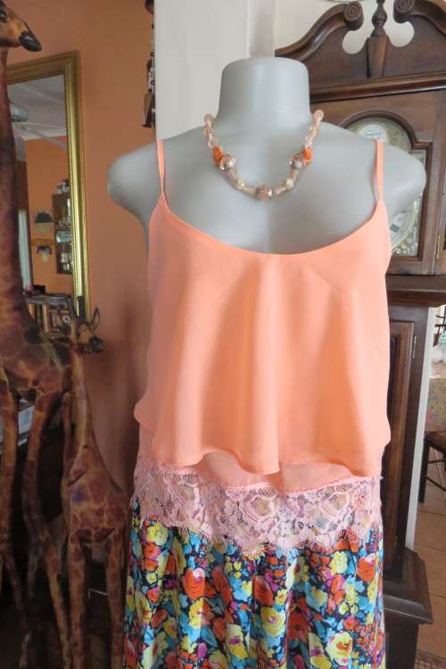 Sexy peach colour cropped strappy top in 2 layers. Size 32/8. Bottom layer with lace seam.