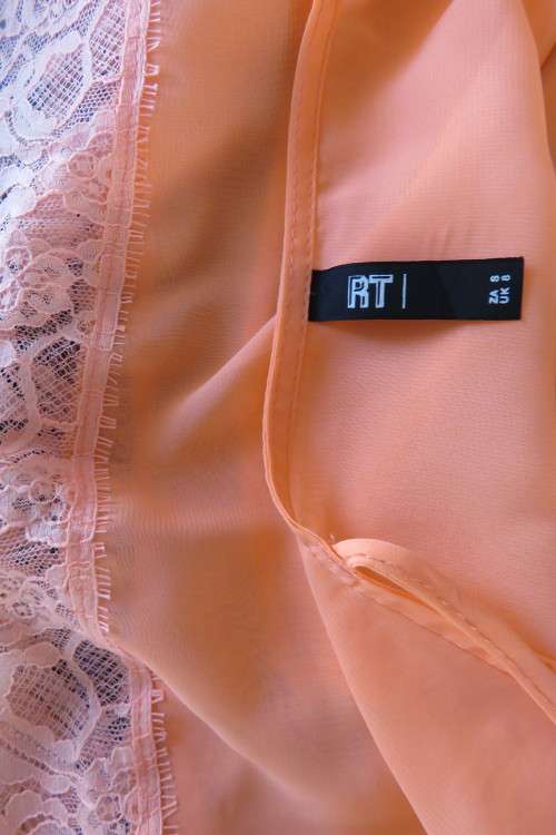Sexy peach colour cropped strappy top in 2 layers. Size 32/8. Bottom layer with lace seam.