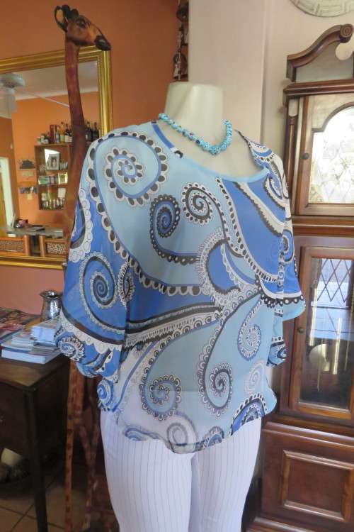 Cool sheer polyester slip over top with rounded seams. By 'Audacity' in size 34/10.