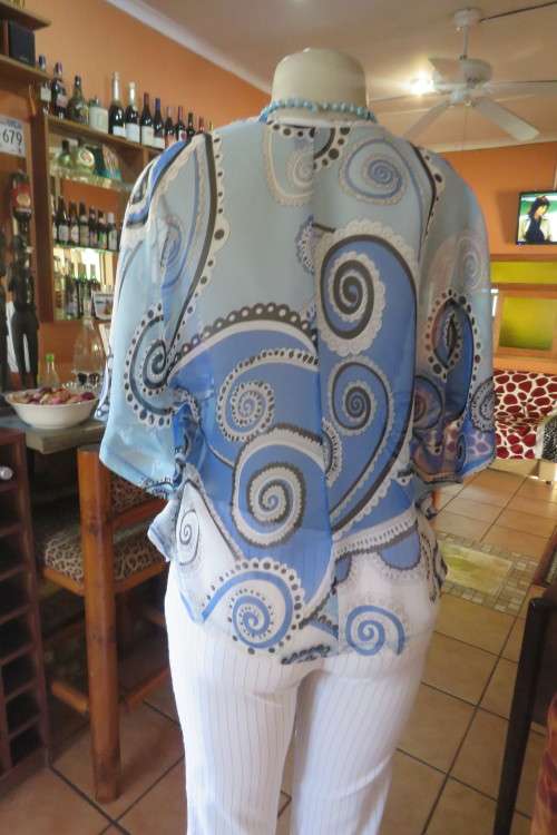 Cool sheer polyester slip over top with rounded seams. By 'Audacity' in size 34/10.
