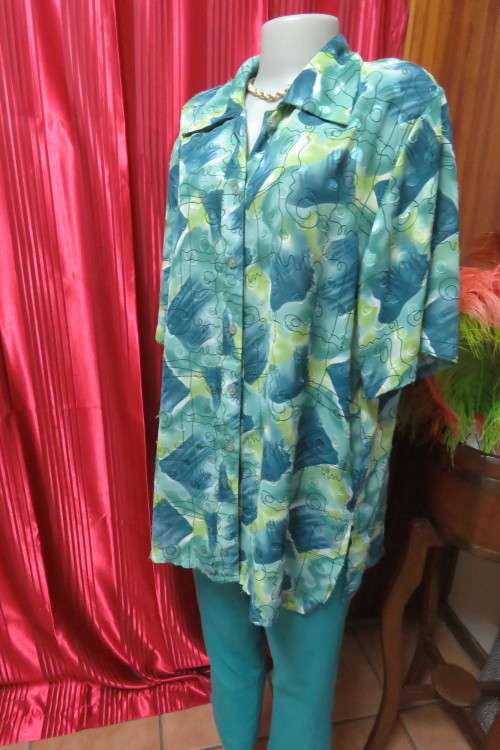 Cheerful summer blouse in medley of greens with black curled lines. Size 44/20.