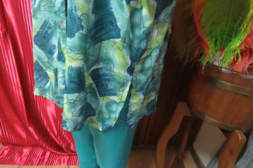 Cheerful summer blouse in medley of greens with black curled lines. Size 44/20.