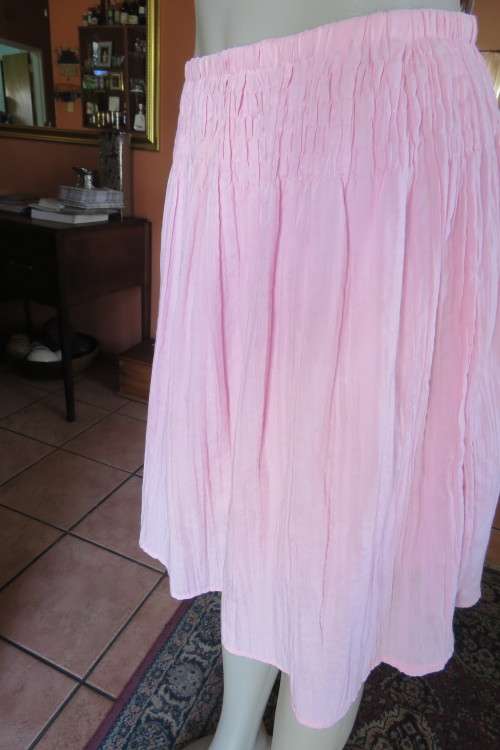Cute carnation pink crinkled knee length skirt. Size 34/10. Smocked yoke. Elasticated waist.As new