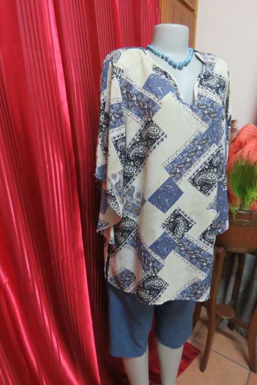 Fabulous rich cream, black and steel blue pattern slip over top in size 42/18.