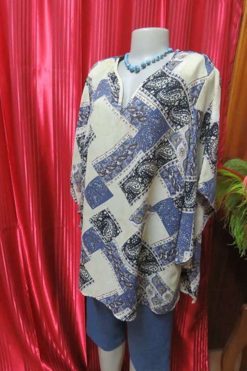 Fabulous rich cream, black and steel blue pattern slip over top in size 42/18.