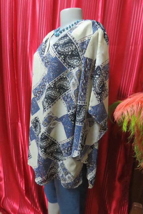 Fabulous rich cream, black and steel blue pattern slip over top in size 42/18.