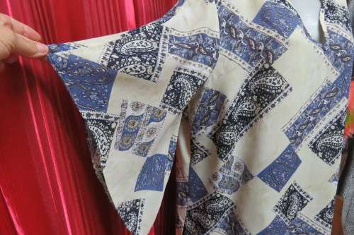 Fabulous rich cream, black and steel blue pattern slip over top in size 42/18.
