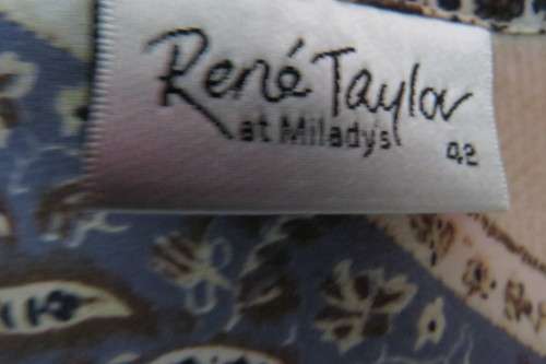 Fabulous rich cream, black and steel blue pattern slip over top in size 42/18.