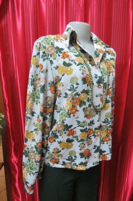 Boutique made long sleeve top size 36/12. Button down front with covered buttons and open collar.
