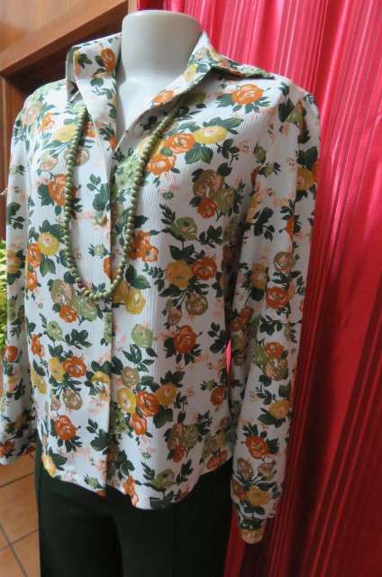 Boutique made long sleeve top size 36/12. Button down front with covered buttons and open collar.