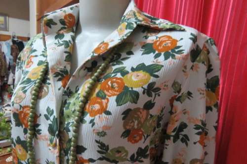 Boutique made long sleeve top size 36/12. Button down front with covered buttons and open collar.