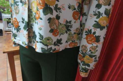 Boutique made long sleeve top size 36/12. Button down front with covered buttons and open collar.