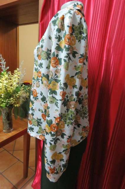 Boutique made long sleeve top size 36/12. Button down front with covered buttons and open collar.