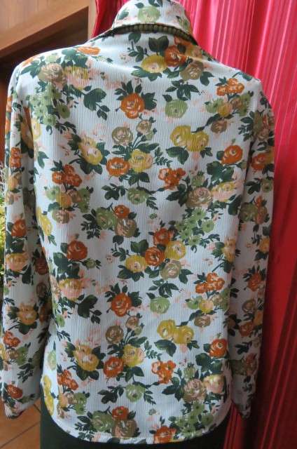Boutique made long sleeve top size 36/12. Button down front with covered buttons and open collar.