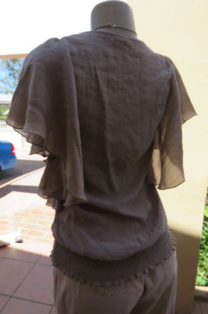 Fabulous little top in size 34/10 by 'Truworths' in ecru colour. Rayon and polyester blend.