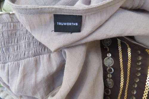 Fabulous little top in size 34/10 by 'Truworths' in ecru colour. Rayon and polyester blend.