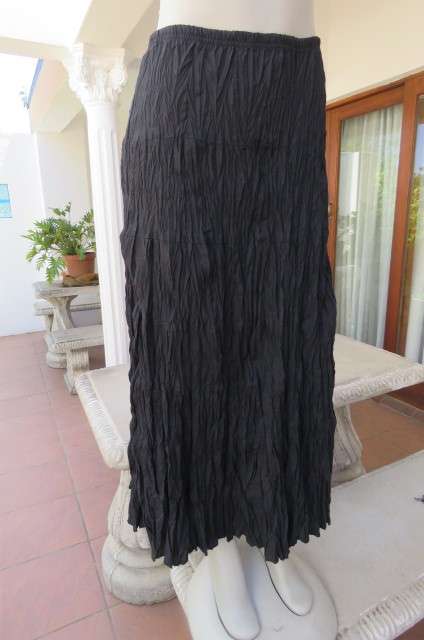 Black long skirt in creased polycotton by 'Edge' in size 36/12. With elasticated waist.