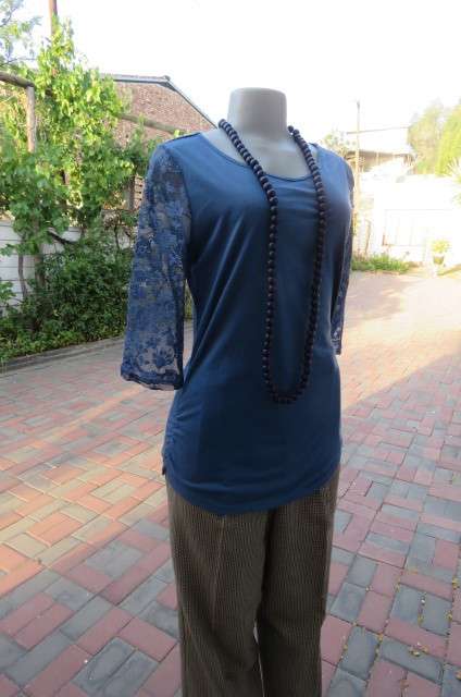 Beautiful steel blue top with scooped neckline. Bracelet length lace sleeves size 34/10 by `Tango`