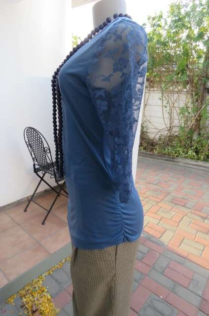 Beautiful steel blue top with scooped neckline. Bracelet length lace sleeves size 34/10 by `Tango`