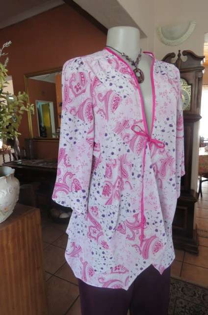 Open hanging pale lilac top with violet and dark purple paisley and floral patterns size 42/18.