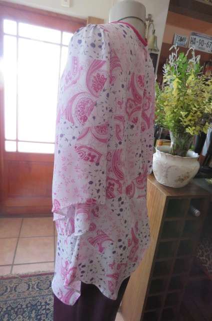 Open hanging pale lilac top with violet and dark purple paisley and floral patterns size 42/18.