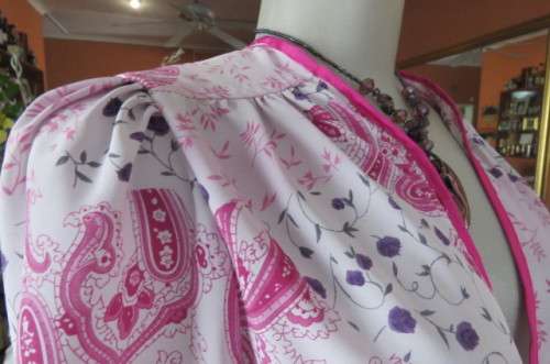 Open hanging pale lilac top with violet and dark purple paisley and floral patterns size 42/18.