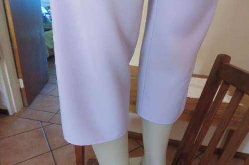 Stylish lilac ankle length pants in size 32/8 with zip at side. Wide waist band. No pockets. As new