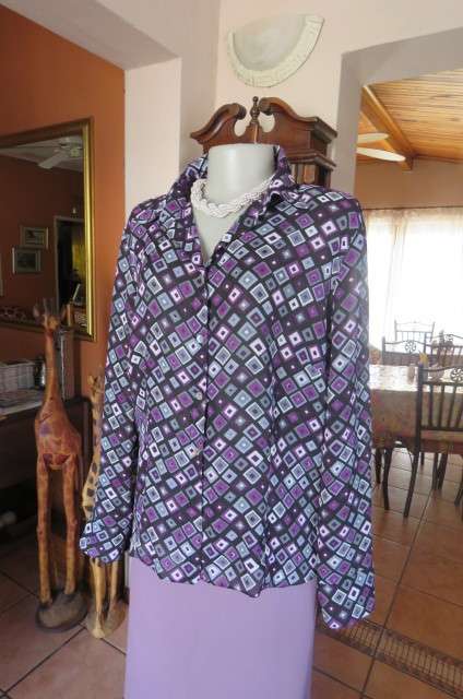 Elegant long sleeve top in black with off line purple, white and grey square blocks. Size 42/18