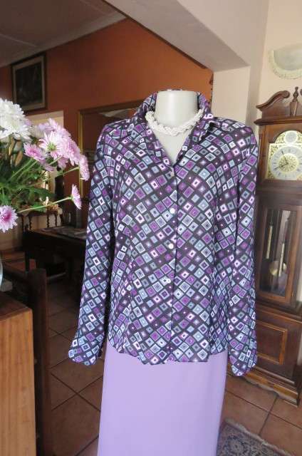 Elegant long sleeve top in black with off line purple, white and grey square blocks. Size 42/18