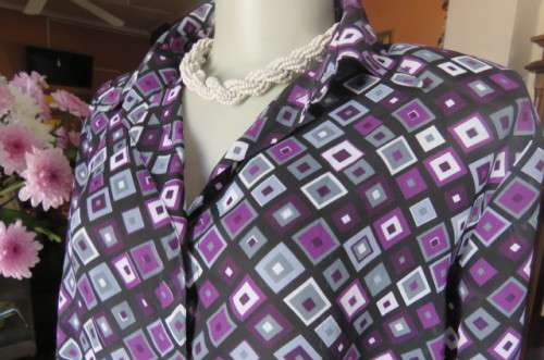 Elegant long sleeve top in black with off line purple, white and grey square blocks. Size 42/18