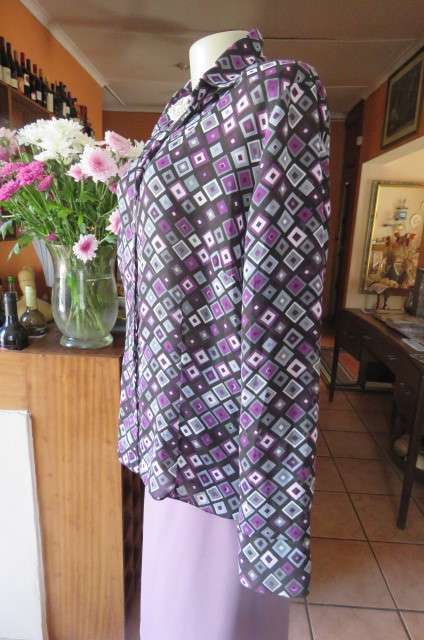 Elegant long sleeve top in black with off line purple, white and grey square blocks. Size 42/18