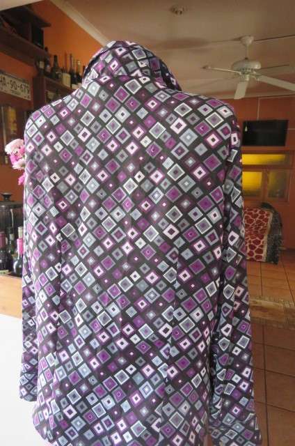 Elegant long sleeve top in black with off line purple, white and grey square blocks. Size 42/18
