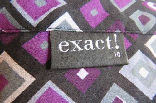 Elegant long sleeve top in black with off line purple, white and grey square blocks. Size 42/18