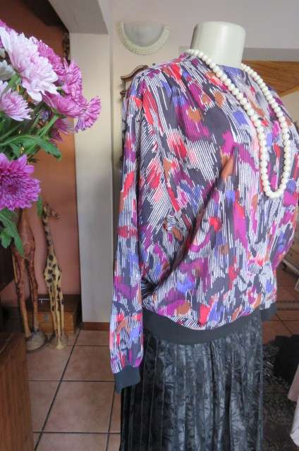 Vintage slip over long sleeve top in size 38/14. Black and white broken vertical stripes with purple