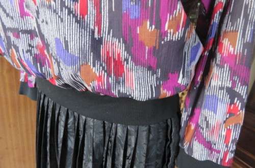 Vintage slip over long sleeve top in size 38/14. Black and white broken vertical stripes with purple