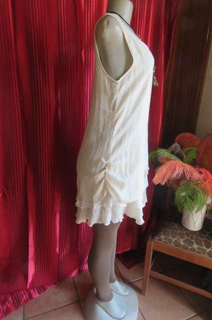 Best quality long cream top with double frilled seam and white underlay, by`Miss Cassidy` size 36/12