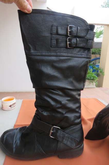 Pair of black calf length size 7 boots by 'Romanss'. Immitation leather. With detail and zip at side