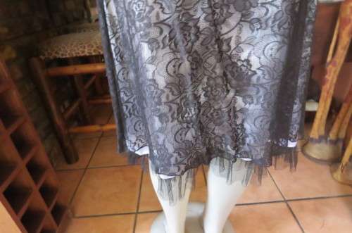 Smart black dress by 'Donna Claire' in size 42/18. Cross over bust with ties.Satin top.