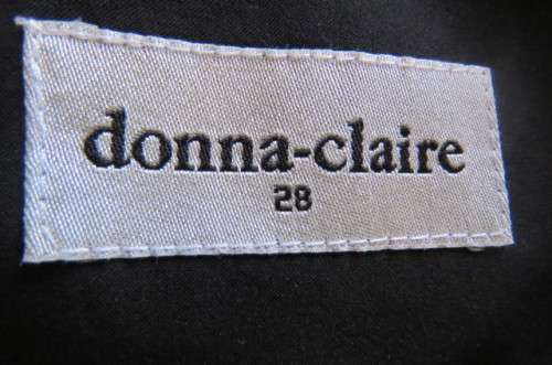 Smart black dress by 'Donna Claire' in size 42/18. Cross over bust with ties.Satin top.