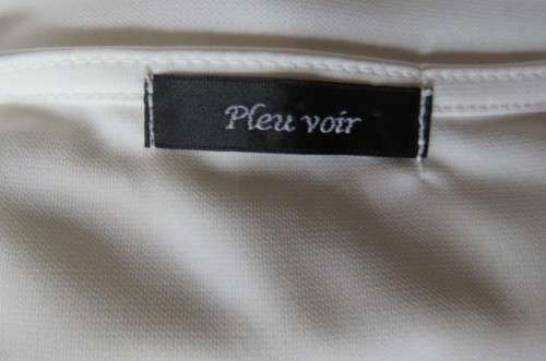 Femininei white top with square sequined neckline. Sleeveless size 36/12.In polyester/nylon.As new