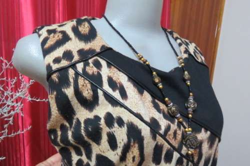Pretty black and caramel colour animal print sleeveless shift dress size 42/18. Zip at back.