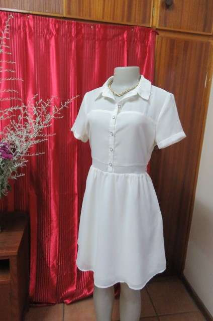 Sweet light cream knee length dress in sheer polyester fabric. Lined skirt size 34/10 by `Legit`.