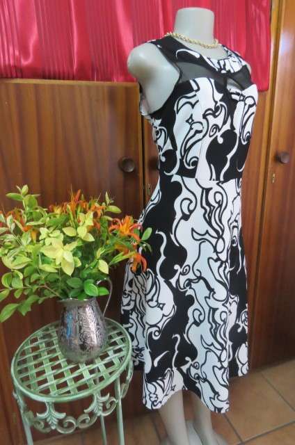 Adorable monochrome dress with sexy skin showing front detail size 37/13. Round neckline.