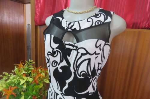 Adorable monochrome dress with sexy skin showing front detail size 37/13. Round neckline.