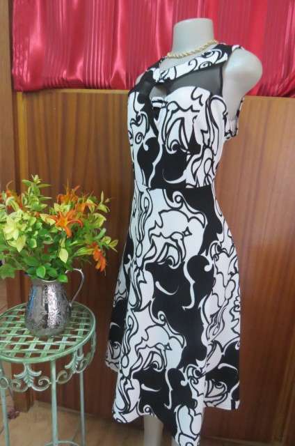 Adorable monochrome dress with sexy skin showing front detail size 37/13. Round neckline.