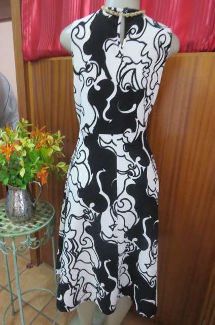 Adorable monochrome dress with sexy skin showing front detail size 37/13. Round neckline.