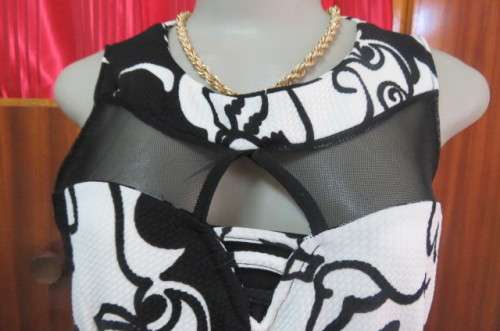 Adorable monochrome dress with sexy skin showing front detail size 37/13. Round neckline.